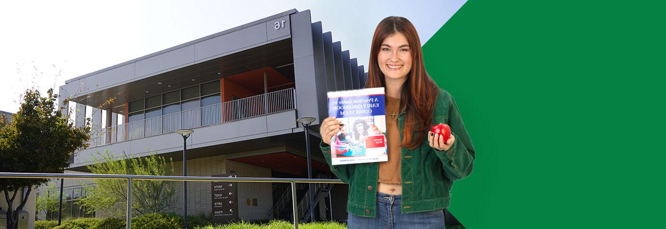 Woman holding a textbook and apple